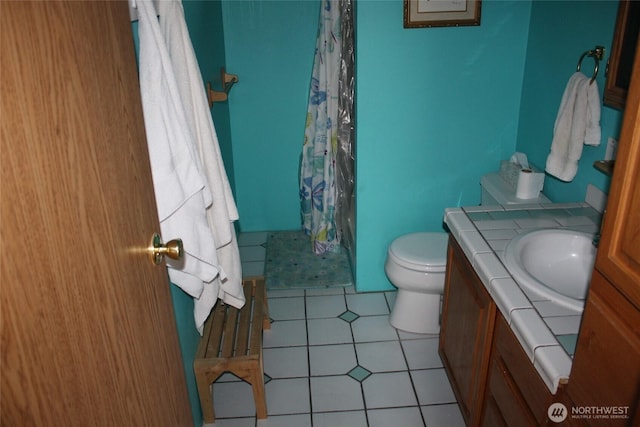 306 E 5th St, Lind, WA 99341 - full bathroom featuring vanity, toilet, tile patterned flooring, and curtained shower