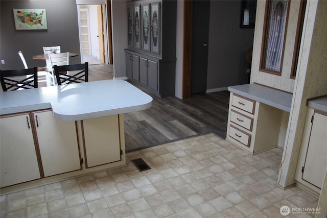 306 E 5th St, Lind, WA 99341 - kitchen with light countertops, baseboards, and light wood-style floors