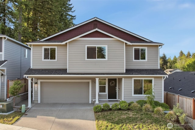534 Gilbertson Ln SE, Olympia, WA 98501 - traditional-style home featuring driveway, an attached garage, and a shingled roof