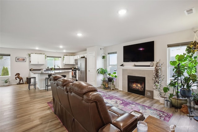 534 Gilbertson Ln SE, Olympia, WA 98501 - living room with light wood-type flooring, a fireplace, and recessed lighting