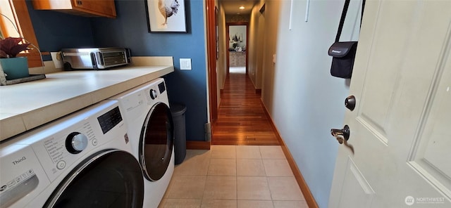 8145 Chehalis Rd, Blaine, WA 98230 - laundry room featuring washer and clothes dryer, baseboards, and light tile patterned floors