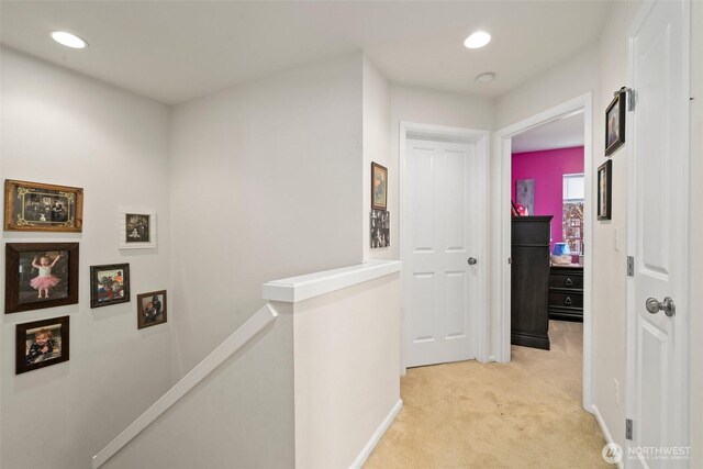 6600 Carolina St SE, Lacey, WA 98513 - corridor with an upstairs landing, light carpet, recessed lighting, and baseboards