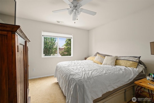 6600 Carolina St SE, Lacey, WA 98513 - bedroom featuring light carpet, baseboards, and ceiling fan