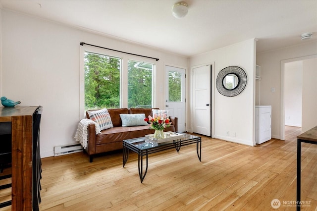 4191 N Imperial Ln, Oak Harbor, WA 98277 - living room featuring baseboard heating, light wood-style flooring, and baseboards