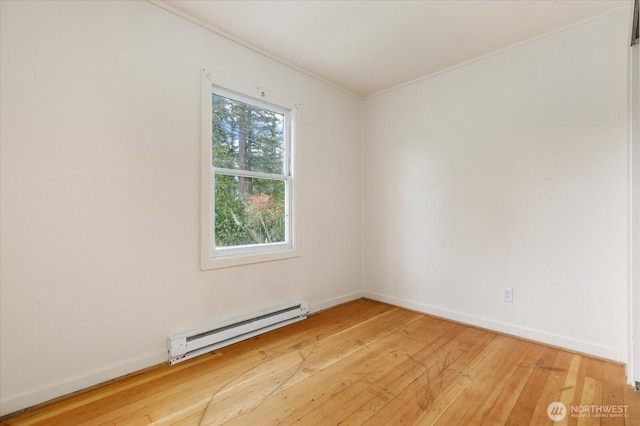 4191 N Imperial Ln, Oak Harbor, WA 98277 - empty room featuring baseboard heating, light wood-type flooring, crown molding, and baseboards
