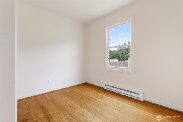 4191 N Imperial Ln, Oak Harbor, WA 98277 - spare room with a baseboard radiator, light wood finished floors, and baseboards