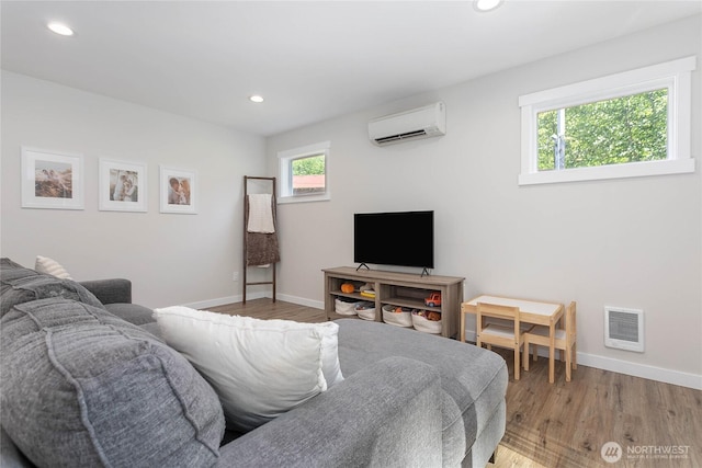 8367 Dolphin Way, Maple Falls, WA 98266 - living room featuring healthy amount of natural light, an AC wall unit, baseboards, and recessed lighting