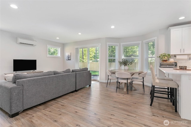 8367 Dolphin Way, Maple Falls, WA 98266 - living area with a wall mounted air conditioner, light wood-style flooring, recessed lighting, and baseboards