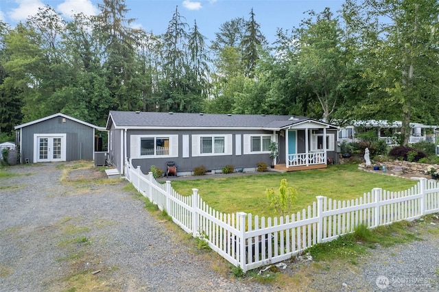 16210 118th Avenue Ct E, Puyallup, WA 98374 - view of front of property with french doors, central AC, roof with shingles, a wooden deck, and view of scattered trees