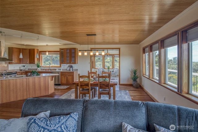 144 Sand Dune Ave SW, Ocean Shores, WA 98569 - dining area with wooden ceiling, dark wood-style floors, and baseboards