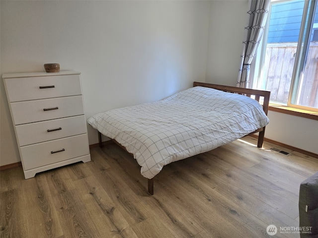 10127 Terra Valley St SE, Yelm, WA 98597 - bedroom with wood finished floors and baseboards