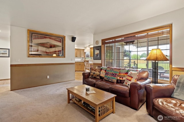 14406 144th St E, Orting, WA 98360 - living room featuring light colored carpet and a wainscoted wall