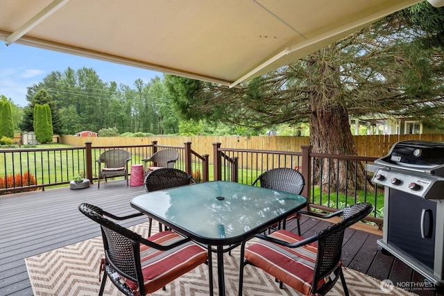 14406 144th St E, Orting, WA 98360 - wooden terrace featuring outdoor dining space, grilling area, and view of wooded area