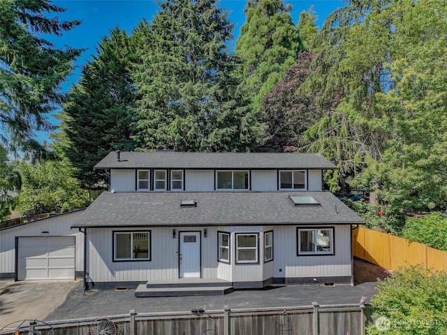 16828 Ambaum Blvd S, Burien, WA 98148 - view of front of property featuring a shingled roof, a fenced front yard, a garage, and driveway
