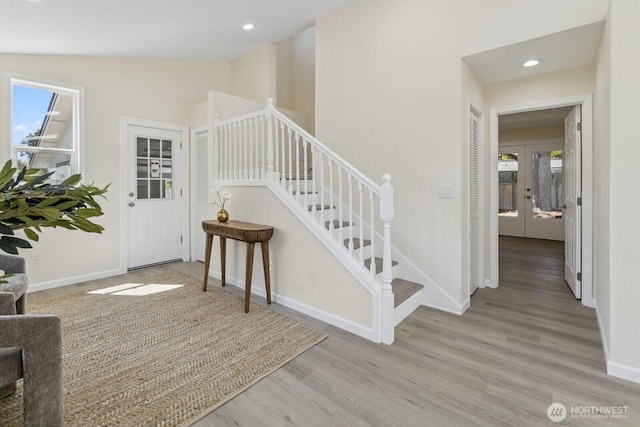 16828 Ambaum Blvd S, Burien, WA 98148 - stairway featuring healthy amount of natural light, wood finished floors, lofted ceiling, recessed lighting, and french doors