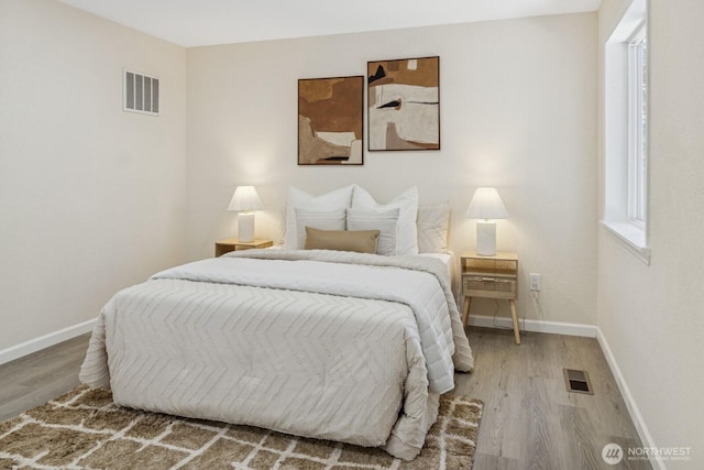 16828 Ambaum Blvd S, Burien, WA 98148 - bedroom with baseboards and wood finished floors