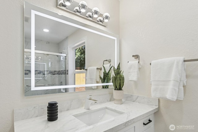 16828 Ambaum Blvd S, Burien, WA 98148 - bathroom featuring vanity, a shower stall, and a textured wall
