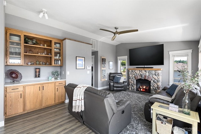 37981 Hood Canal Dr NE, Hansville, WA 98340 - living room with ceiling fan, dark wood-style floors, a stone fireplace, and baseboards