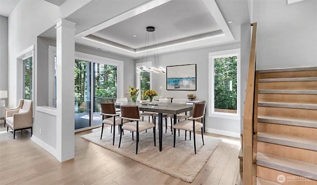 1542 213th Ct NE, Sammamish, WA 98074 - dining area featuring stairway, a tray ceiling, plenty of natural light, and light wood-style flooring