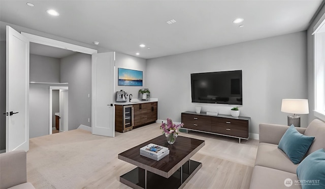 1542 213th Ct NE, Sammamish, WA 98074 - living area with wine cooler, recessed lighting, light wood-style floors, and bar with sink