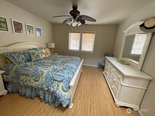 304 Sr 150 Unit 1A, Chelan, WA 98816 - bedroom with light wood finished floors, baseboards, and a ceiling fan