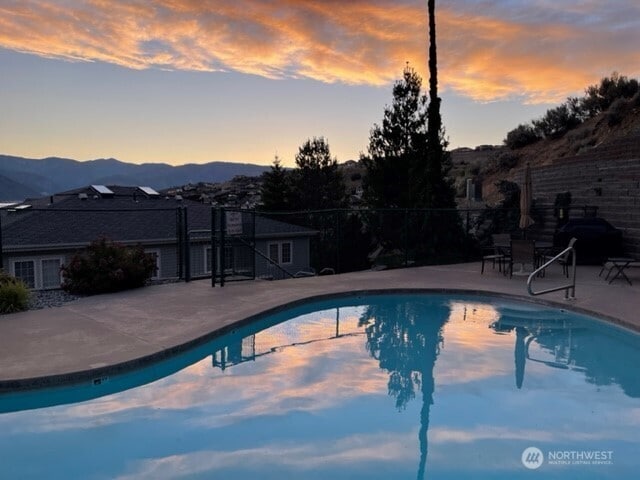 304 Sr 150 Unit 1A, Chelan, WA 98816 - view of swimming pool with a mountain view and a patio