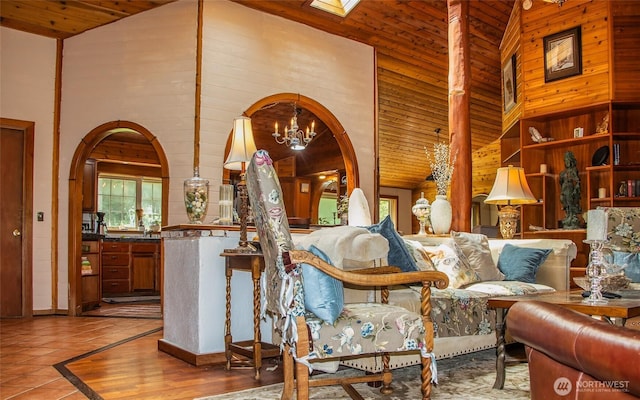 70 Cole Ave, Port Townsend, WA 98368 - living area with a chandelier, arched walkways, high vaulted ceiling, wooden ceiling, and tile patterned flooring