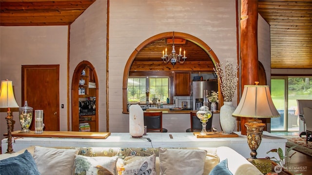 70 Cole Ave, Port Townsend, WA 98368 - living area featuring a chandelier, healthy amount of natural light, high vaulted ceiling, wood ceiling, and arched walkways