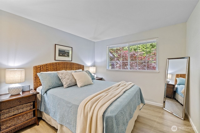 23311 Cedar Way Unit P201, Mountlake Terrace, WA 98043 - bedroom featuring light wood finished floors and baseboards