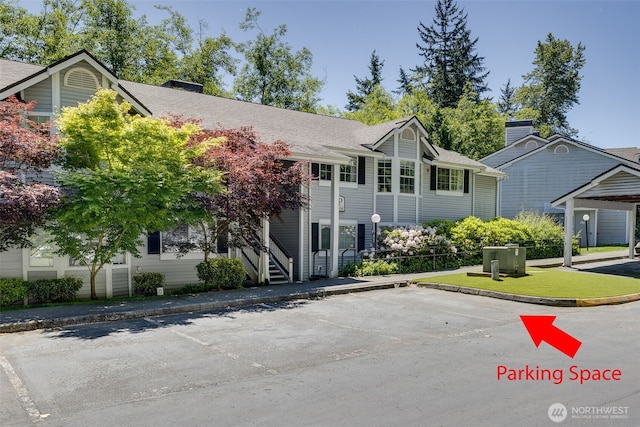 23311 Cedar Way Unit P201, Mountlake Terrace, WA 98043 - townhome / multi-family property with a chimney, uncovered parking, and a shingled roof
