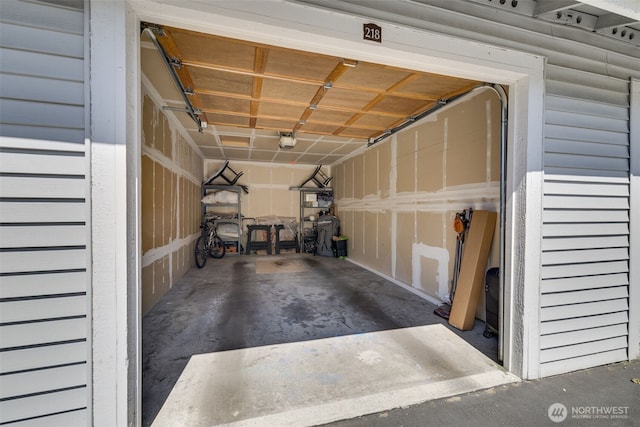 23311 Cedar Way Unit P201, Mountlake Terrace, WA 98043 - garage with a garage door opener