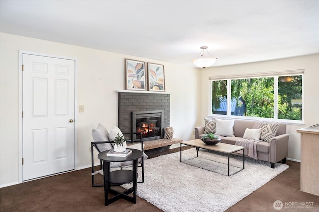 4404 Lopez St, Port Townsend, WA 98368 - living room with a fireplace, dark carpet, and baseboards