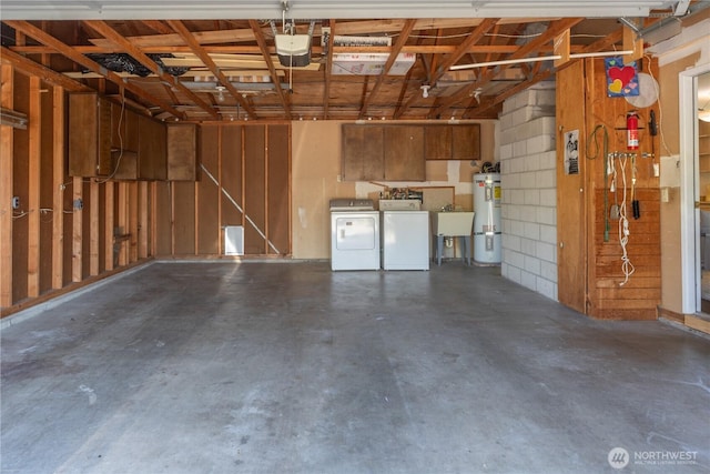 4404 Lopez St, Port Townsend, WA 98368 - garage with secured water heater, washer and dryer, a sink, and a garage door opener