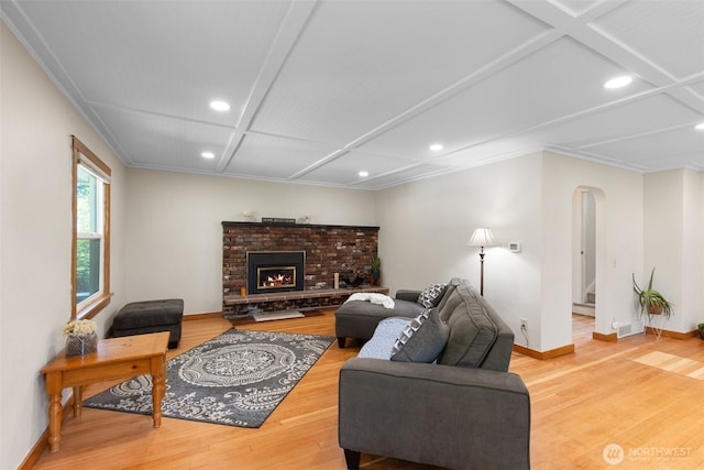 1010 Tacoma Ave, Port Orchard, WA 98366 - living area with arched walkways, recessed lighting, wood finished floors, baseboards, and coffered ceiling