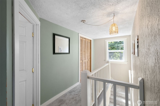 1010 Tacoma Ave, Port Orchard, WA 98366 - corridor with a textured ceiling, an upstairs landing, carpet, and baseboards