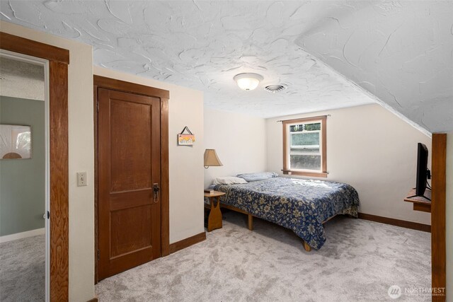 1010 Tacoma Ave, Port Orchard, WA 98366 - carpeted bedroom featuring baseboards and a textured ceiling