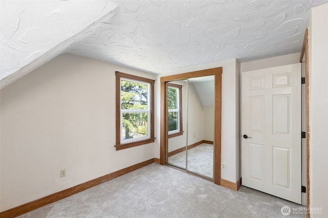 1010 Tacoma Ave, Port Orchard, WA 98366 - bonus room featuring carpet, lofted ceiling, a textured ceiling, and baseboards