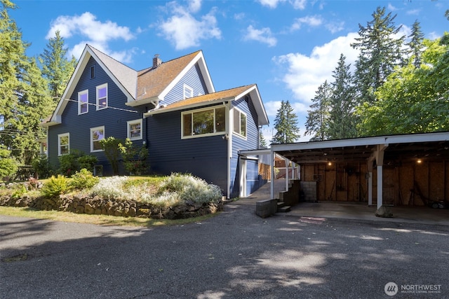 1010 Tacoma Ave, Port Orchard, WA 98366 - view of front of home featuring a chimney and a carport