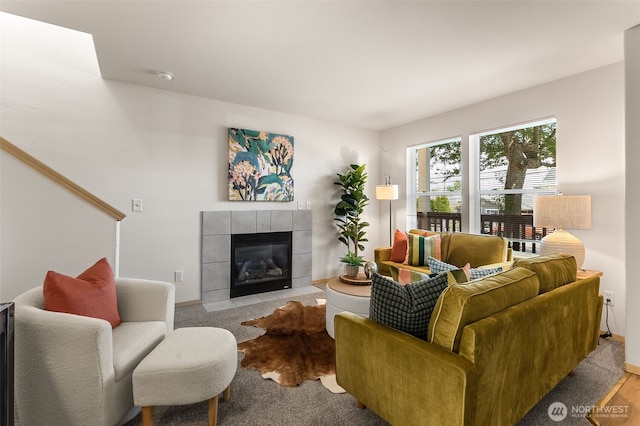 10049 17th Ave SW, Seattle, WA 98146 - living room featuring a tiled fireplace and baseboards