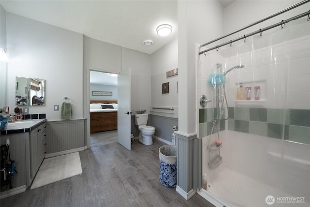 10419 Sandridge Rd, Long Beach, WA 98631 - full bathroom featuring wood finished floors, a stall shower, and vanity