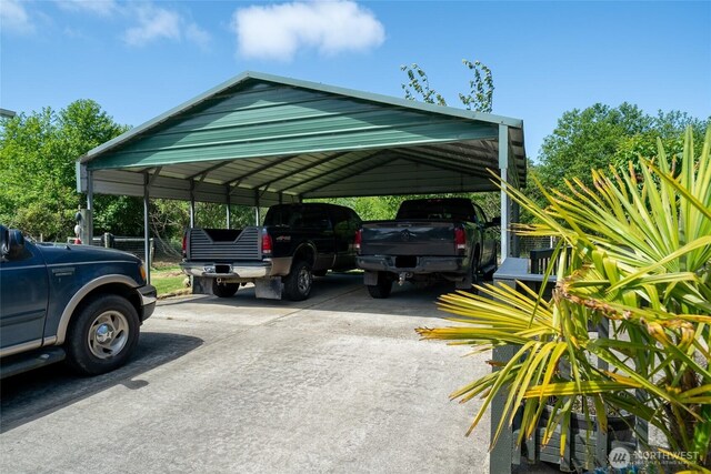 10419 Sandridge Rd, Long Beach, WA 98631 - view of parking / parking lot featuring a carport and driveway