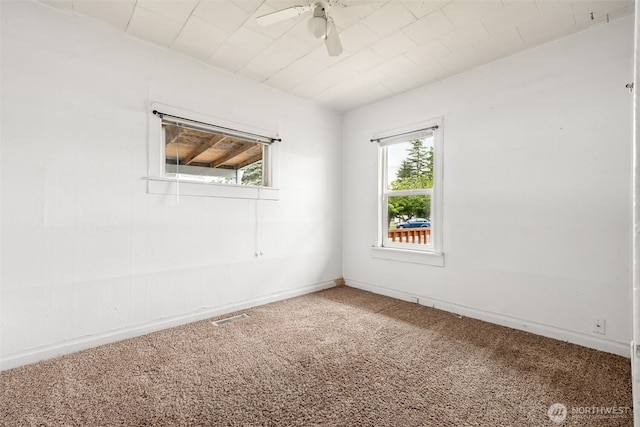 1863 Loraine St, Enumclaw, WA 98022 - spare room with carpet floors, a ceiling fan, and baseboards