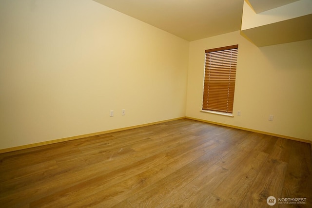 1031 N State St Unit 402, Bellingham, WA 98226 - empty room with wood finished floors and baseboards
