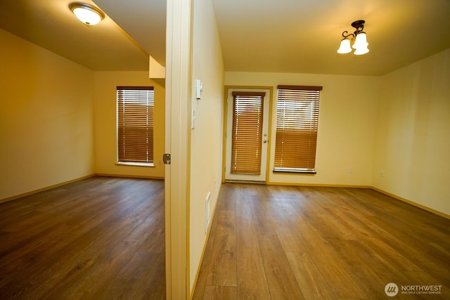 1031 N State St Unit 402, Bellingham, WA 98226 - unfurnished room with wood-type flooring and baseboards