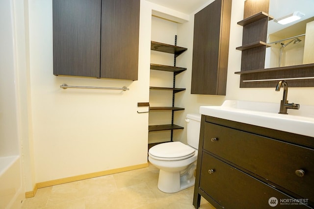 1031 N State St Unit 402, Bellingham, WA 98226 - bathroom with vanity, toilet, a shower with shower curtain, baseboards, and tile patterned flooring