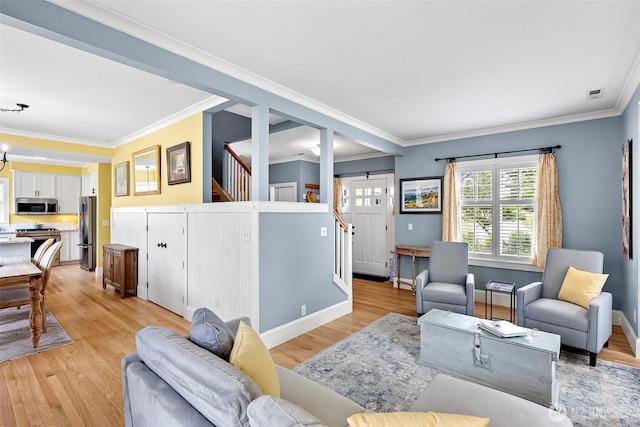 1747 Parade Grounds Ave NE, Bainbridge Island, WA 98110 - living area featuring stairway, light wood-style flooring, and crown molding