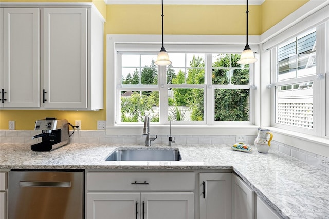 1747 Parade Grounds Ave NE, Bainbridge Island, WA 98110 - kitchen featuring dishwasher, pendant lighting, white cabinets, and light stone countertops