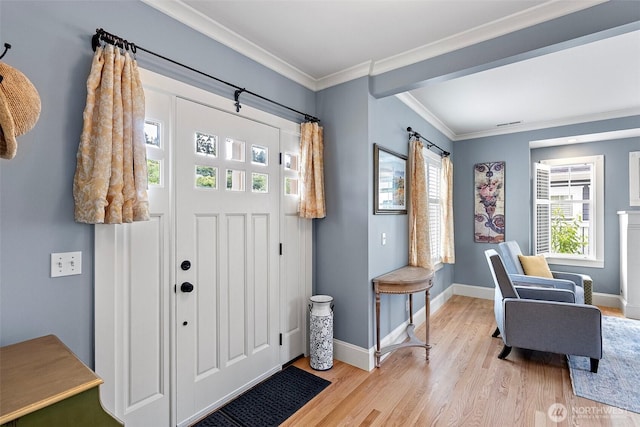 1747 Parade Grounds Ave NE, Bainbridge Island, WA 98110 - entrance foyer featuring light wood-style flooring and crown molding