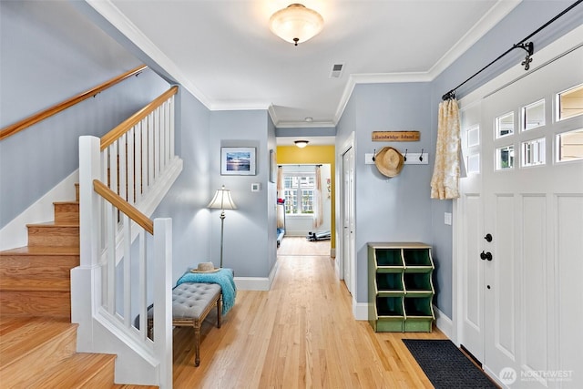 1747 Parade Grounds Ave NE, Bainbridge Island, WA 98110 - entryway featuring ornamental molding, stairway, and light wood-type flooring