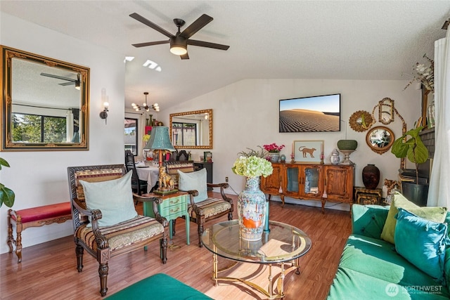 29103 46th Pl S, Auburn, WA 98001 - living area featuring wood finished floors, lofted ceiling, a ceiling fan, a chandelier, and baseboards